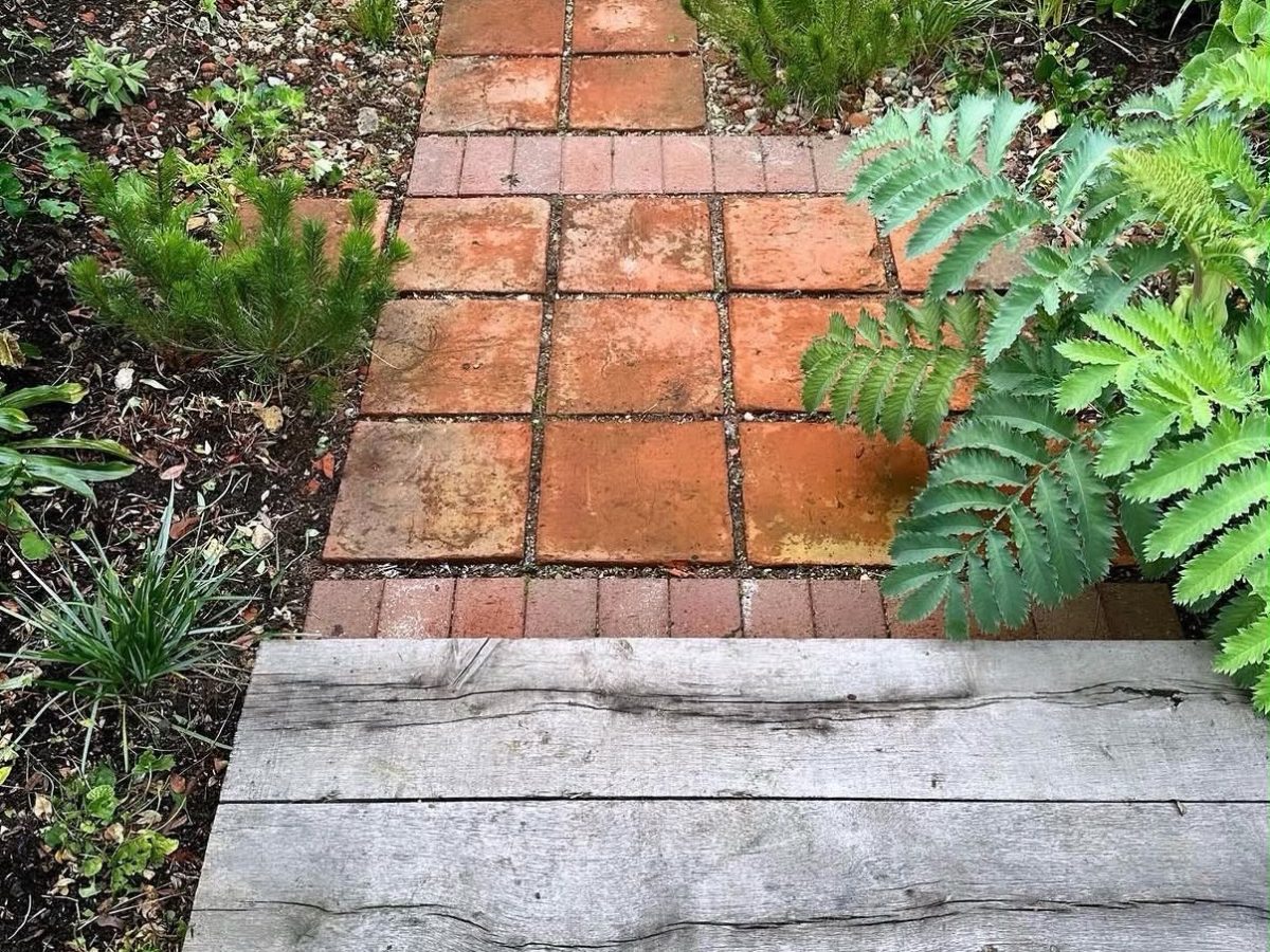 Renovated planting amongst reclaimed terracotta and oak