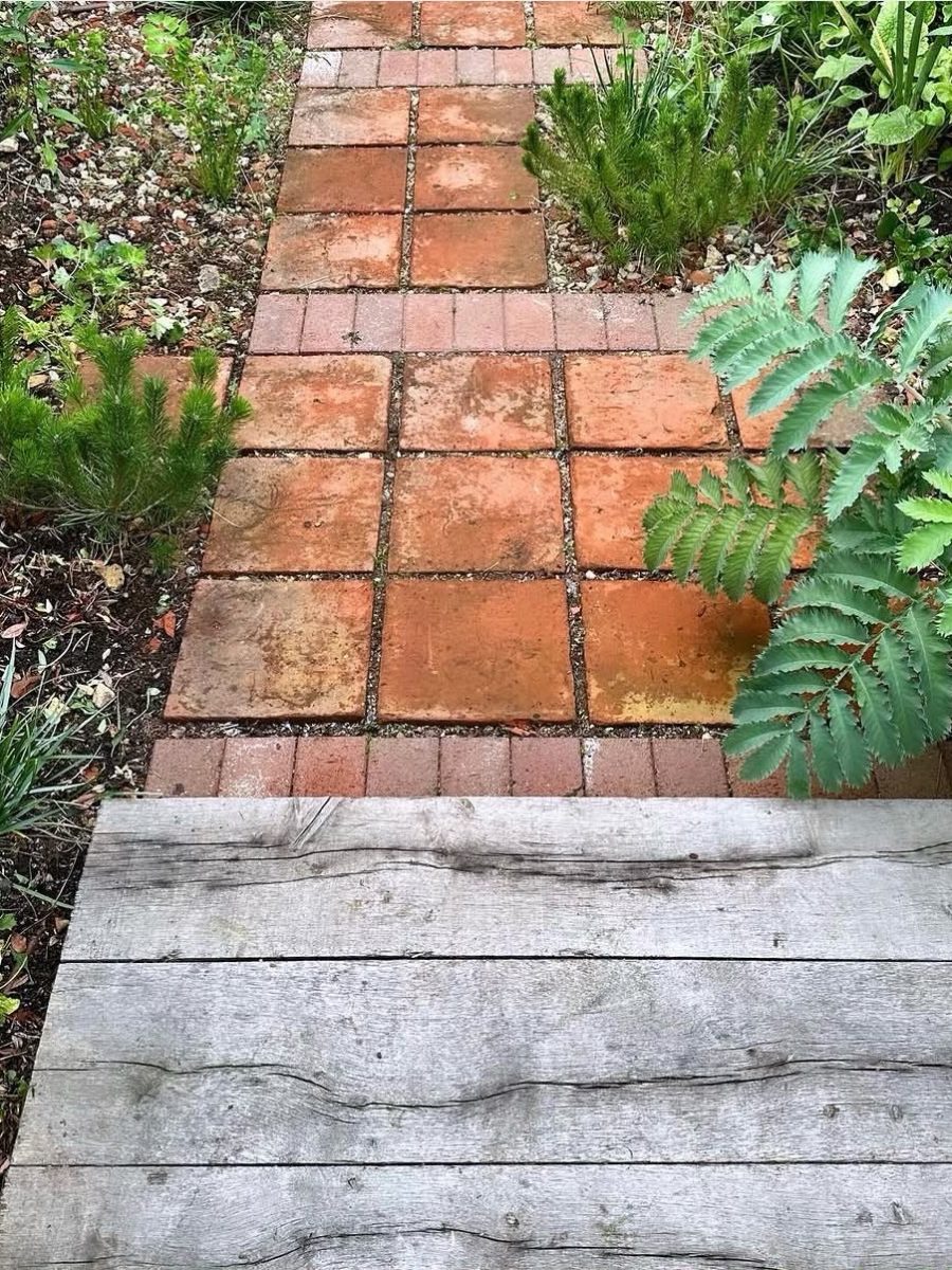 Renovated planting amongst reclaimed terracotta and oak