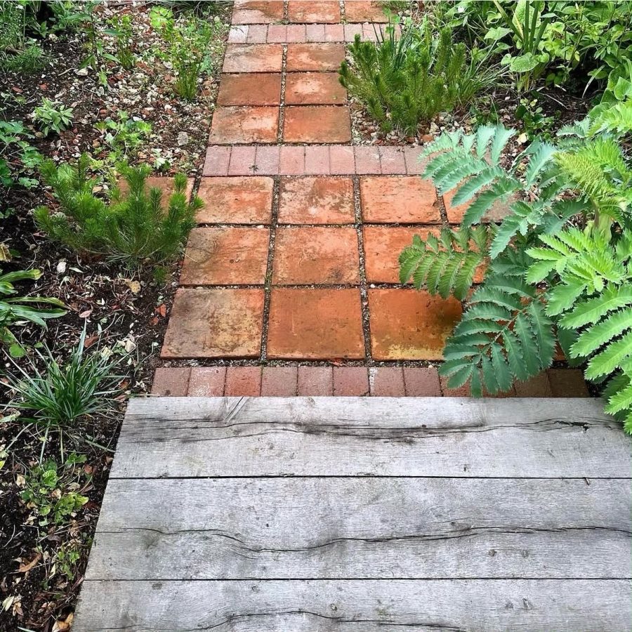Renovated planting amongst reclaimed terracotta and oak