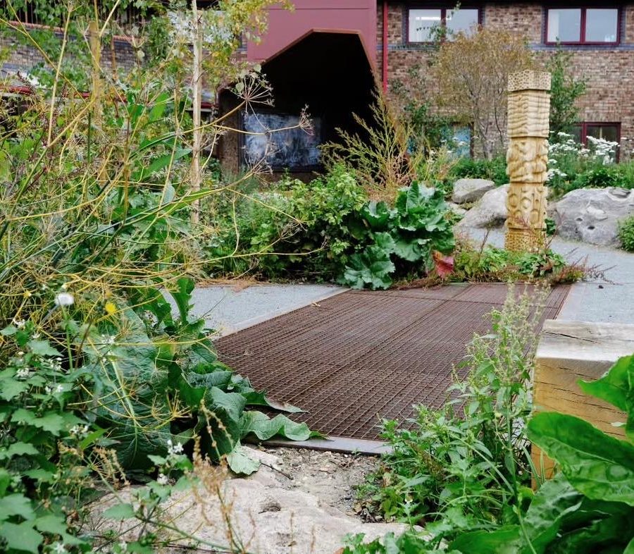 Corten steel arch over the garden path