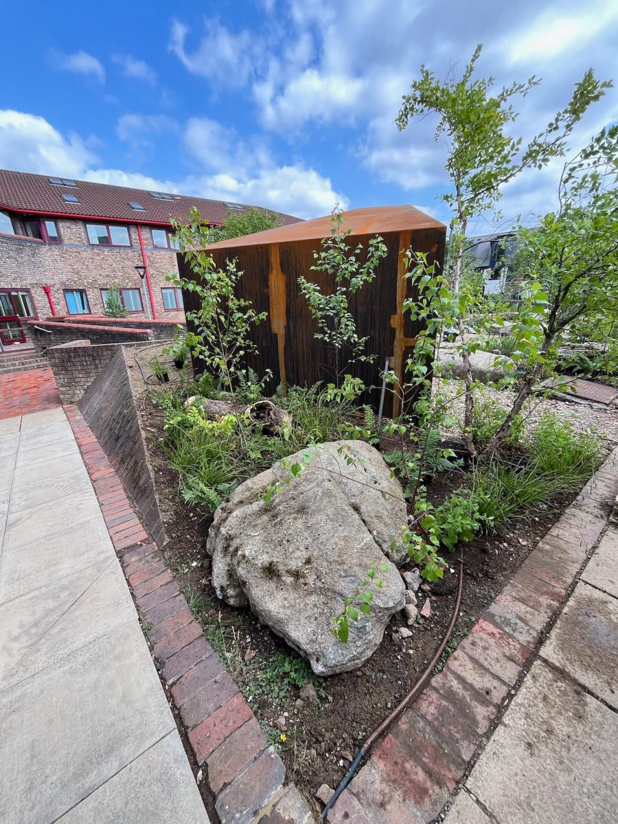 Corten planters and boulder planting