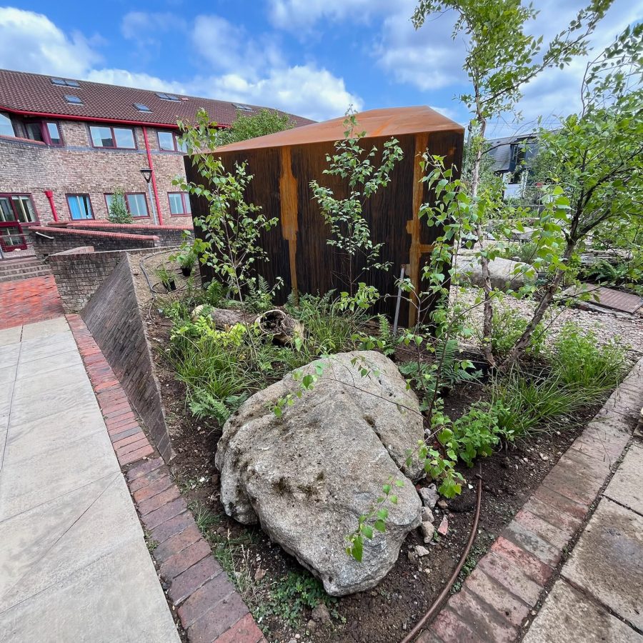 Corten planters and boulder planting